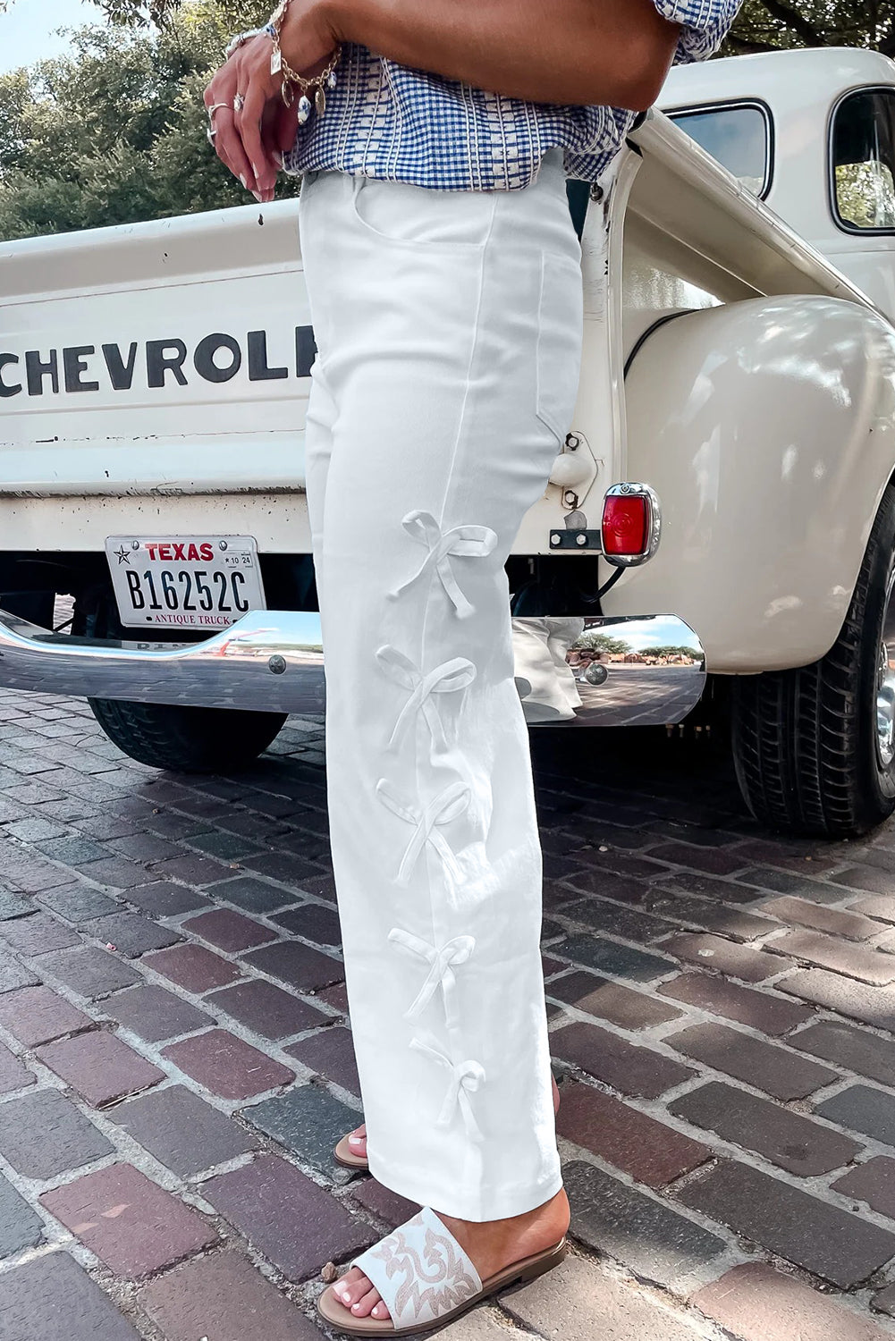 White Dear-Lover loose straight-leg jeans with bow knot side detail and cotton-elastane blend, casual bottoms for a relaxed look.
