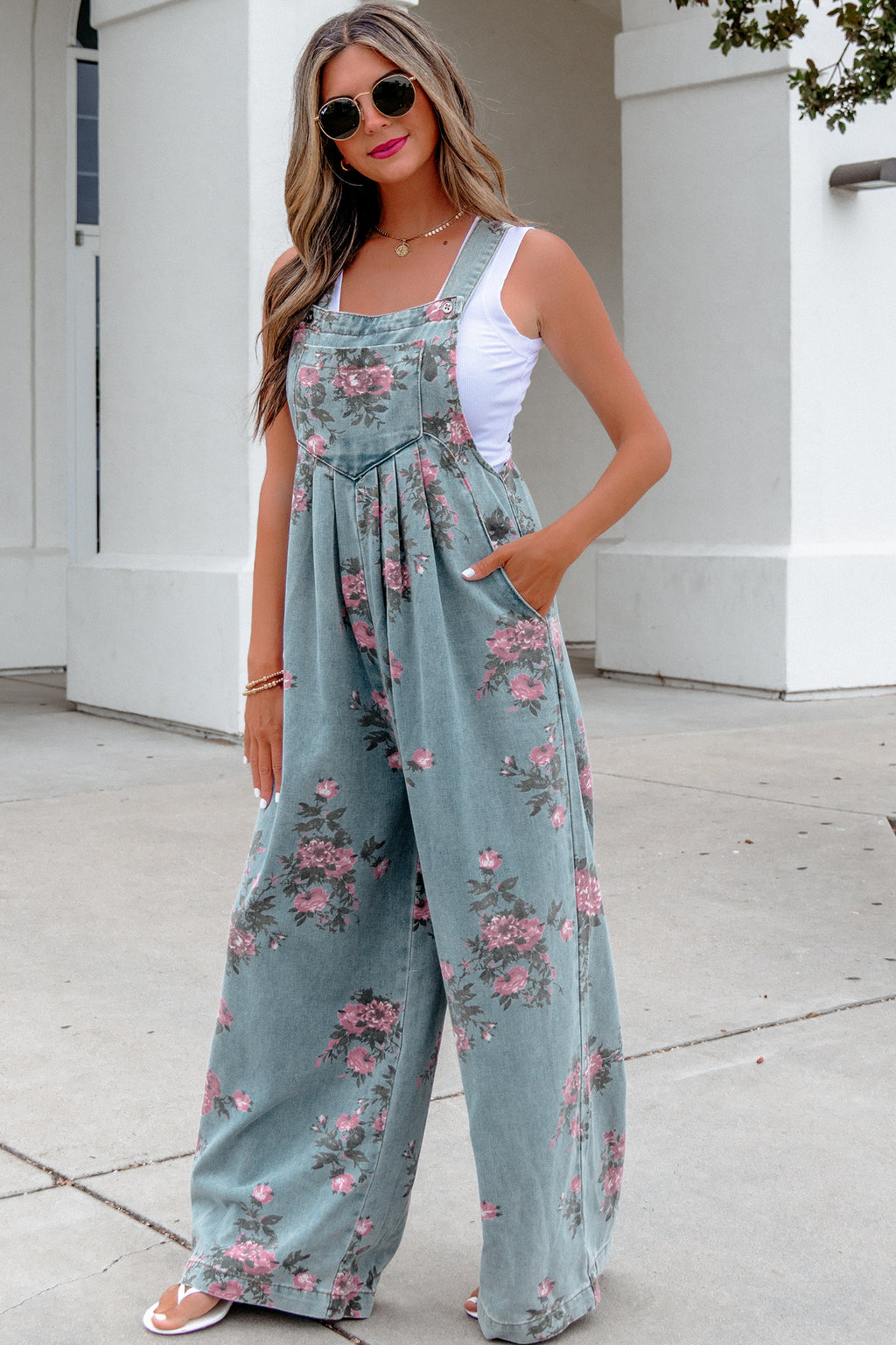Dear-Lover Blue floral print denim jumpsuit with high waist, pleated design, wide leg, perfect for casual or stylish looks.