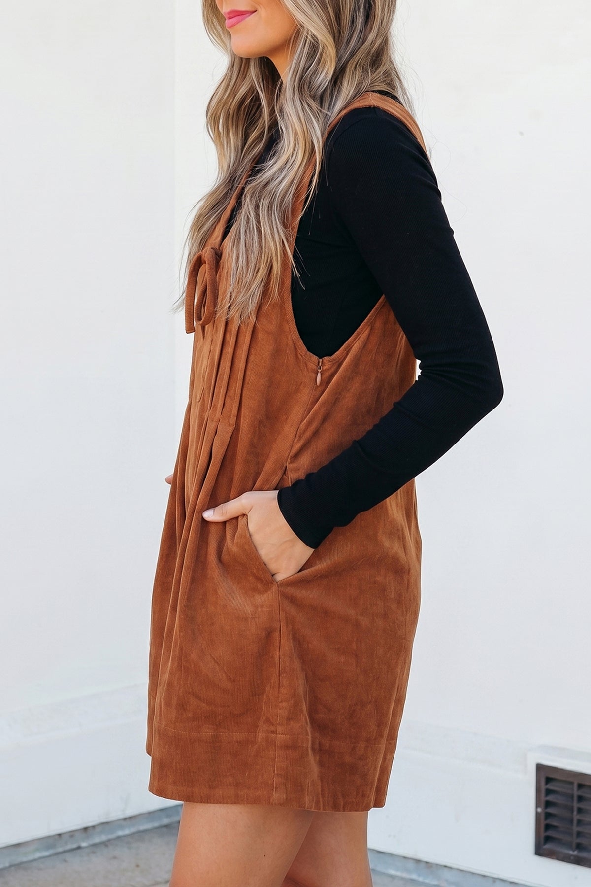 Cinnamon solid color V-neck sleeveless corduroy romper by Dear-Lover Dropshipping, featuring a tie waist and sleeveless design.