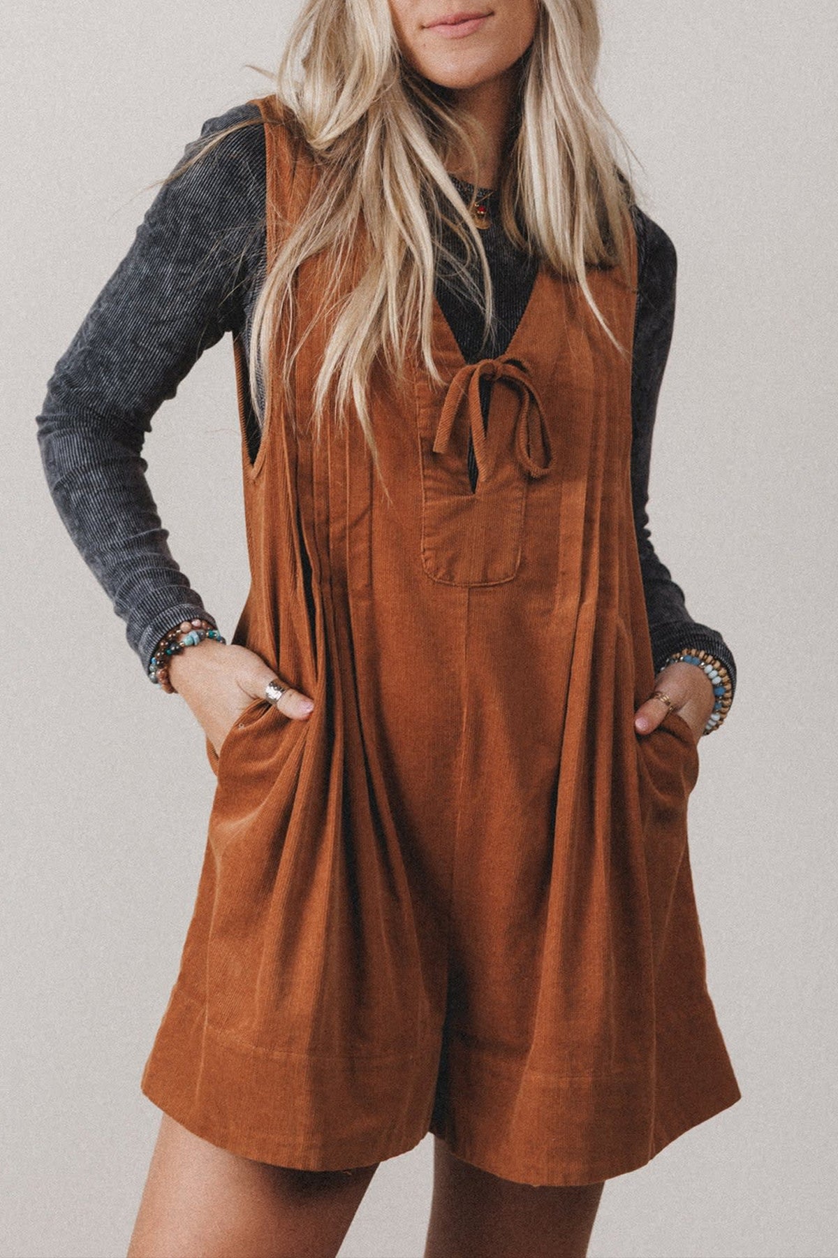 Cinnamon solid color sleeveless corduroy romper with V-neck tie front, from Dear-Lover, featuring a stylish jumpsuit design.
