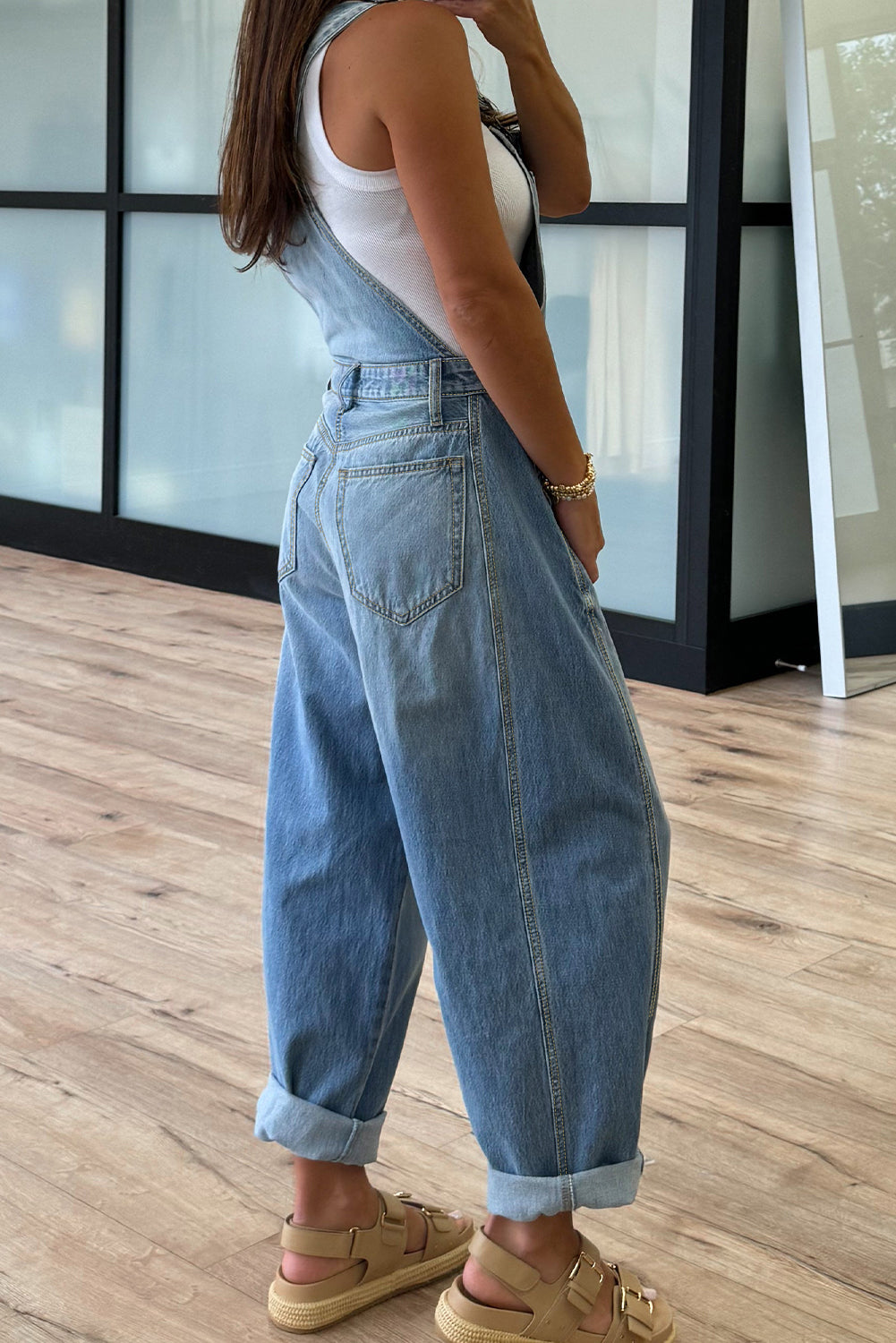 Dusk blue adjustable buckle barrel denim overalls for women, featuring a relaxed fit, made of cotton, polyester, and elastane.