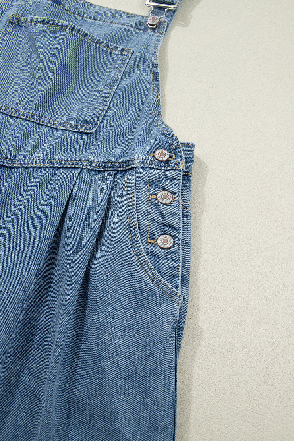 Dusk blue pleated wide-leg denim jumpsuit with retro pockets, made of cotton, polyester, and viscose, by Dear-Lover.