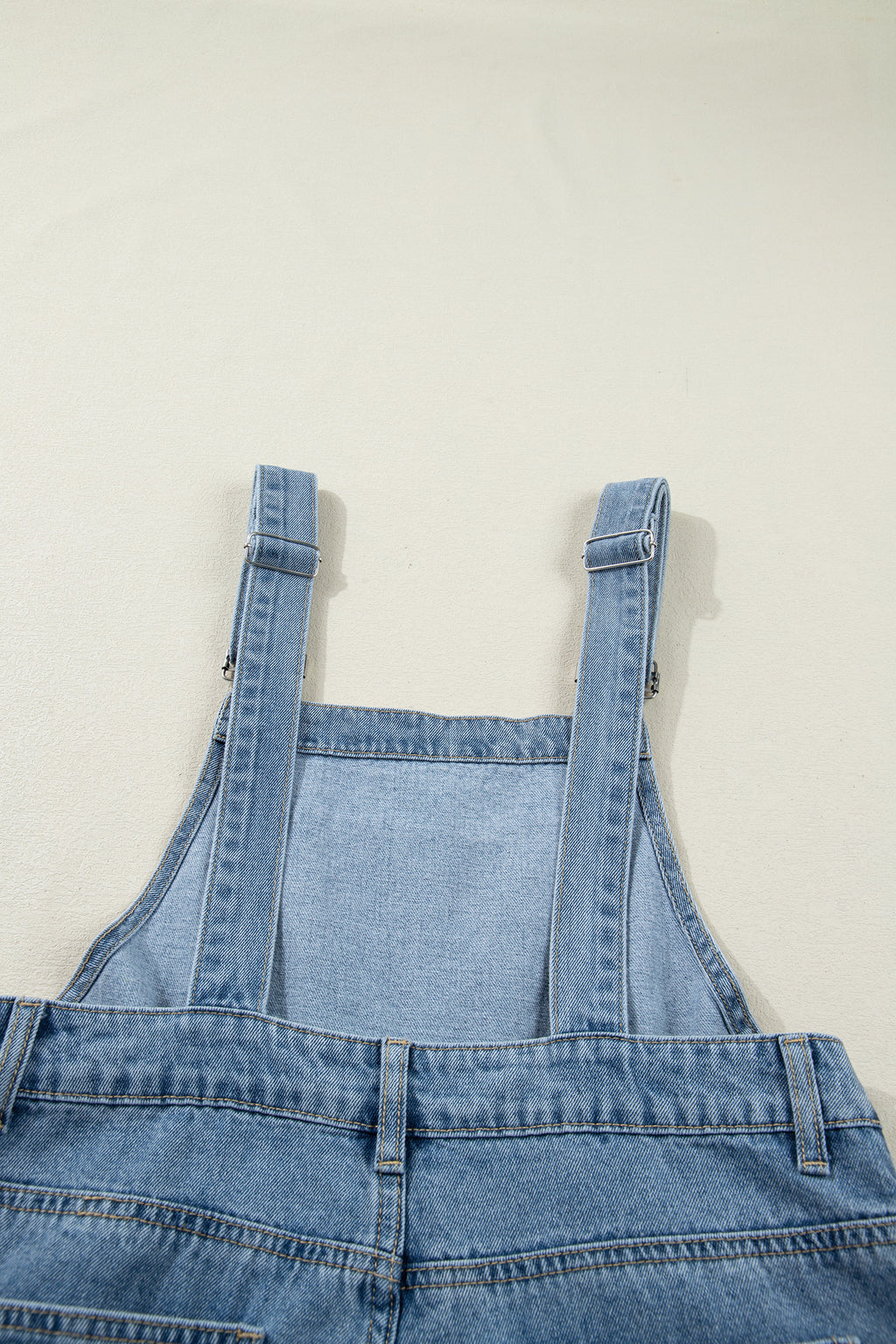 Dusk blue pleated wide-leg denim jumpsuit with retro pockets, made of cotton, polyester, and viscose by Dear-Lover Dropshipping.