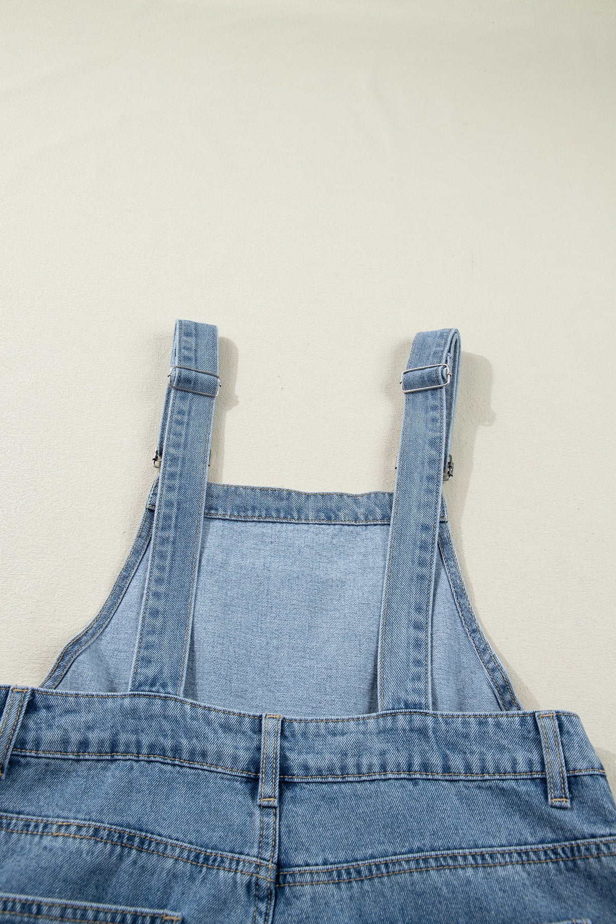 Dusk blue pleated wide-leg denim jumpsuit with retro pockets, made of cotton, polyester, and viscose by Dear-Lover Dropshipping.