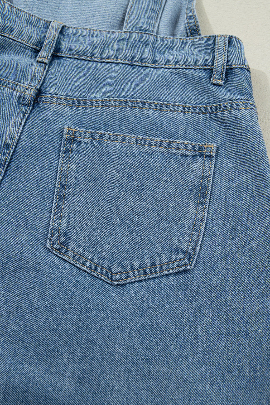 Dusk blue pleated wide-leg denim jumpsuit with retro pockets, featuring a relaxed fit and stylish design by Dear-Lover.