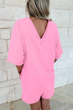 Pink solid color raw edge half sleeve romper with pockets, loose fit, made from cotton and polyester, by Dear-Lover.