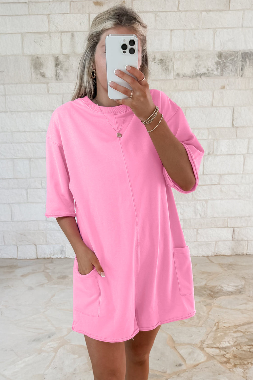 Pink solid color raw edge half sleeve romper with pockets, loose fit, made of cotton and polyester, by Dear-Lover.