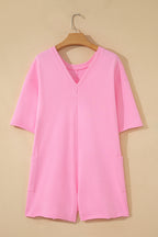 Pink solid color raw edge half sleeve romper with pockets, made of cotton and polyester, loose fit, casual jumpsuit from Dear-Lover.