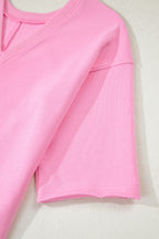 Pink solid color raw edge half sleeve romper with pockets, loose fit, made from cotton and polyester, by Dear-Lover.