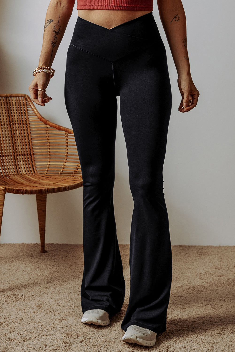 Black V-shape high waist flared leggings by Dear-Lover, featuring a stretchy polyamide and elastane blend and a stylish flared leg design.