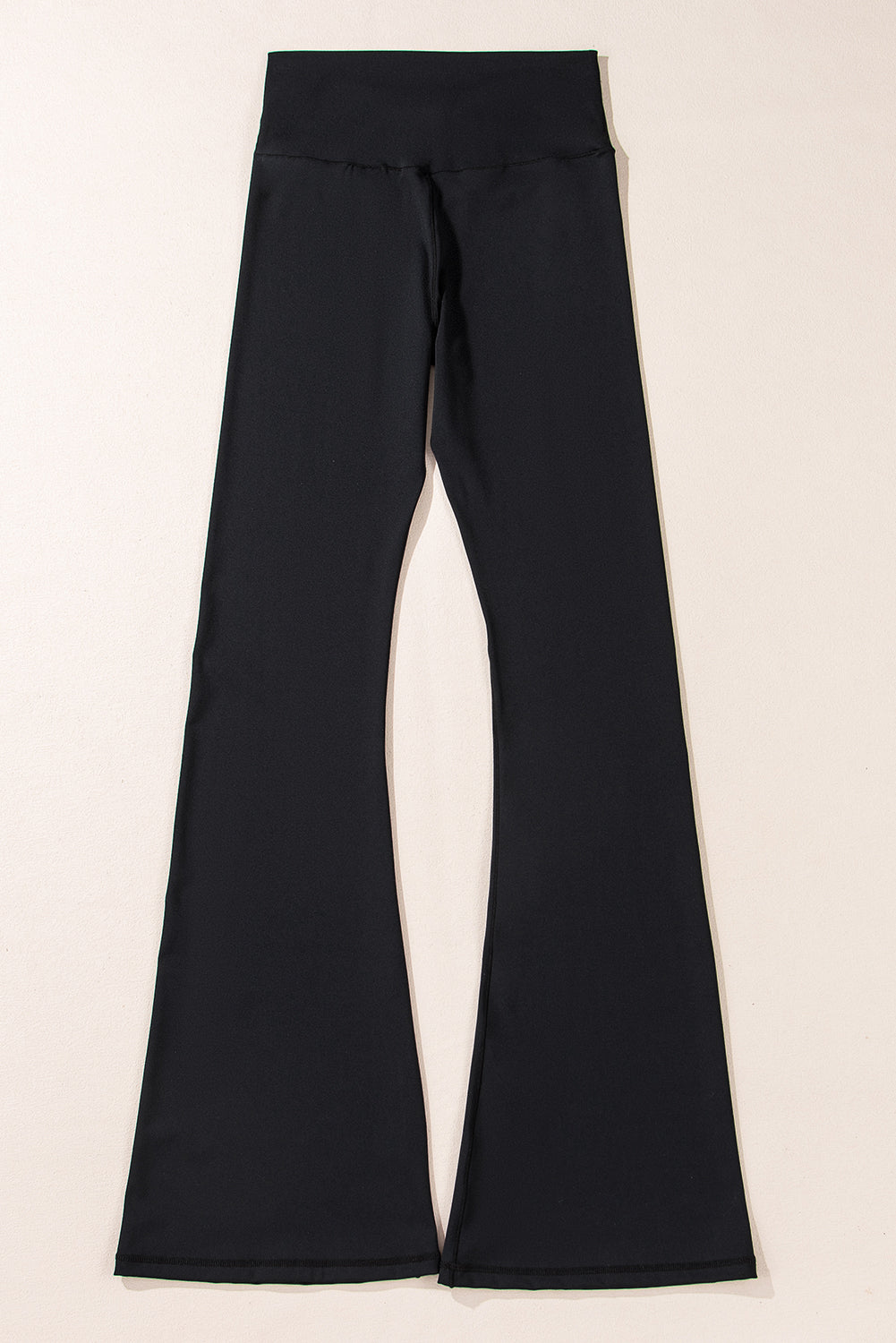 Black V-shaped high waist flared leggings by Dear-Lover, made of polyamide and elastane, showing a fitted waistband and flared leg design.