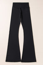 Black V-shaped high waist flared leggings by Dear-Lover, made of polyamide and elastane, showing a fitted waistband and flared leg design.