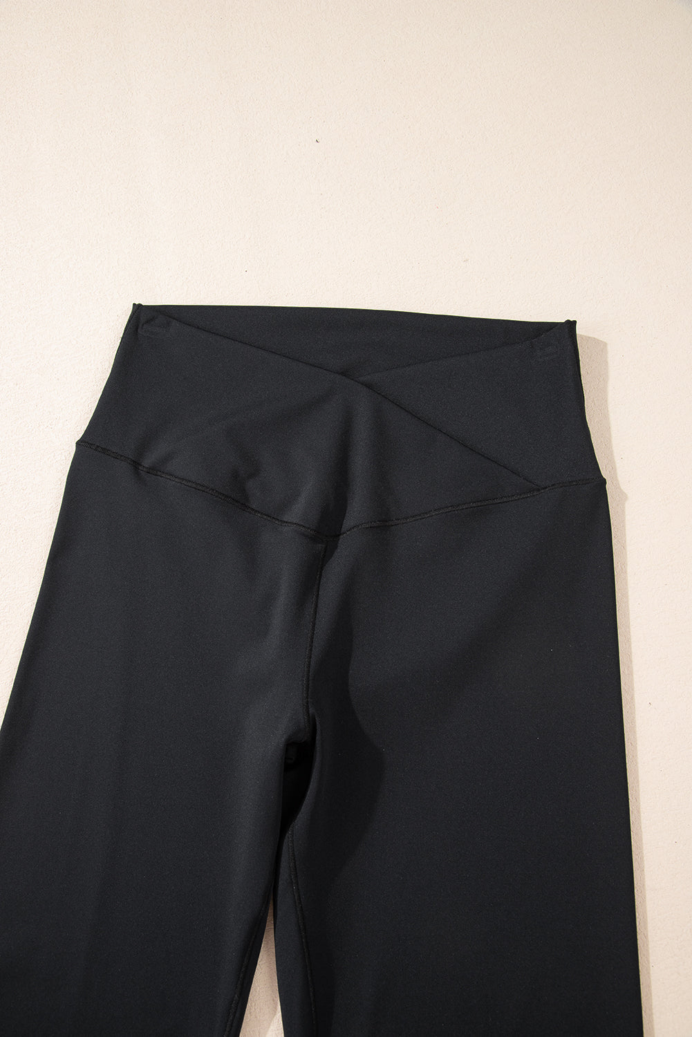 Black V shape high waist flared leggings by Dear-Lover, made of polyamide and elastane, featuring a stylish flared leg design.