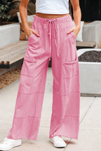 Dear-Lover wide-leg cargo pants with mineral wash finish, exposed seams, drawstring elastic waistband, made of 100% cotton.