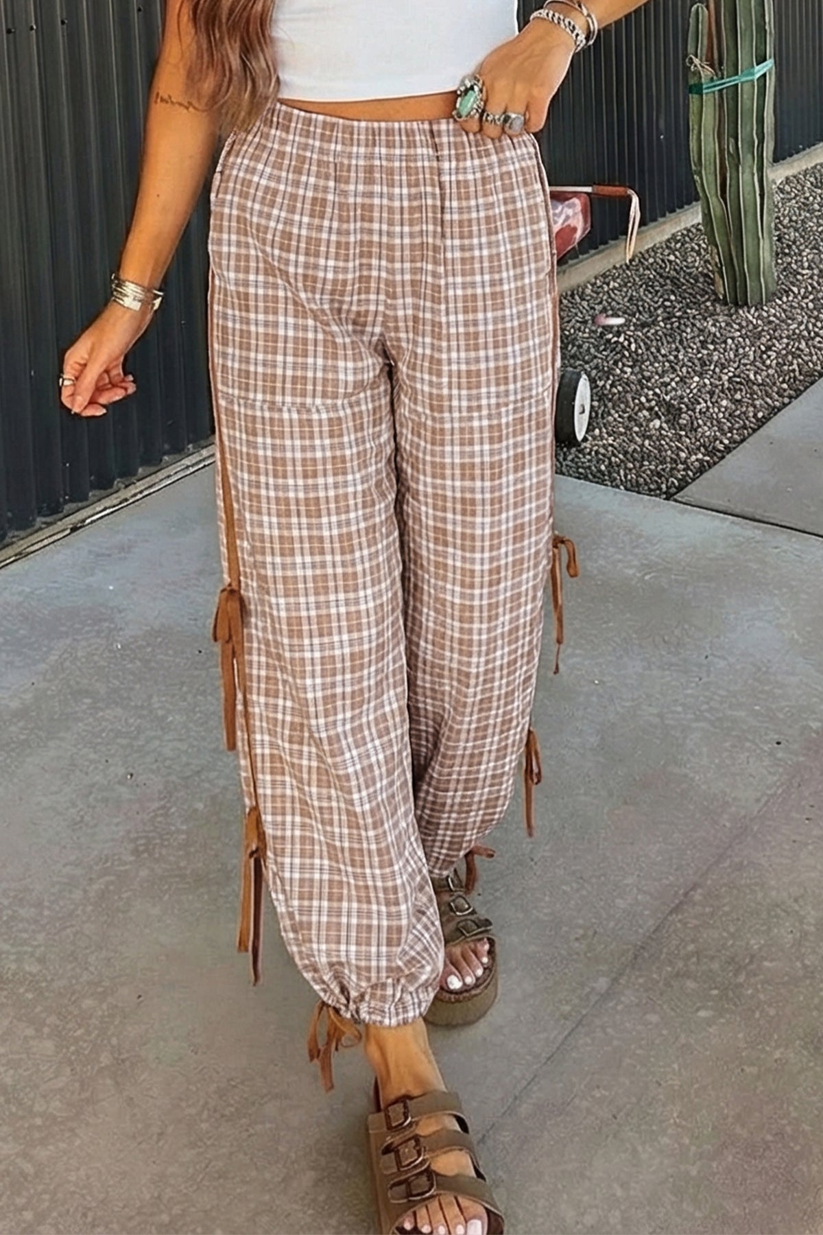 Chestnut plaid print jogger pants from Dear-Lover with elastic waist, bow tie, and contrast detail, made of polyester, viscose, and elastane.