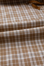 Chestnut plaid print jogger pants with elastic waist, bow tie detail, and contrast accents from Dear-Lover, made of polyester, viscose, and elastane.
