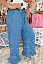 Dusk blue ruffled hem wide-leg chambray pants by Dear-Lover, featuring a relaxed fit and stylish ruffle details at the hem.
