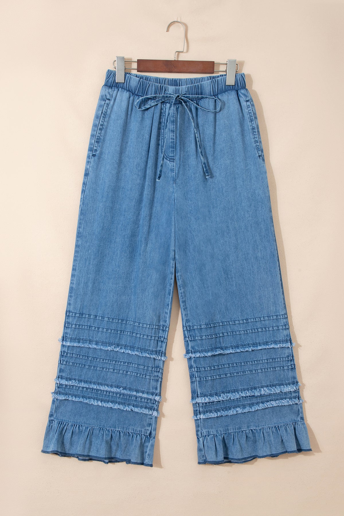 Dusk blue ruffled hem wide-leg chambray pants by Dear-Lover, featuring a relaxed fit and stylish ruffle detail at the hem.
