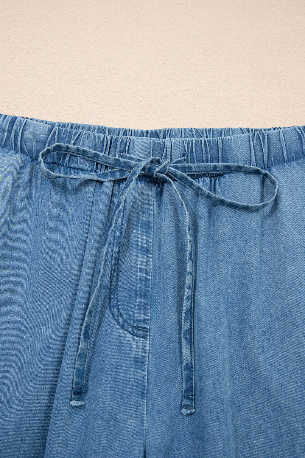 Dusk blue ruffled hem wide-leg chambray pants by Dear-Lover Dropshipping, made of 100% cotton, featuring a stylish relaxed fit.