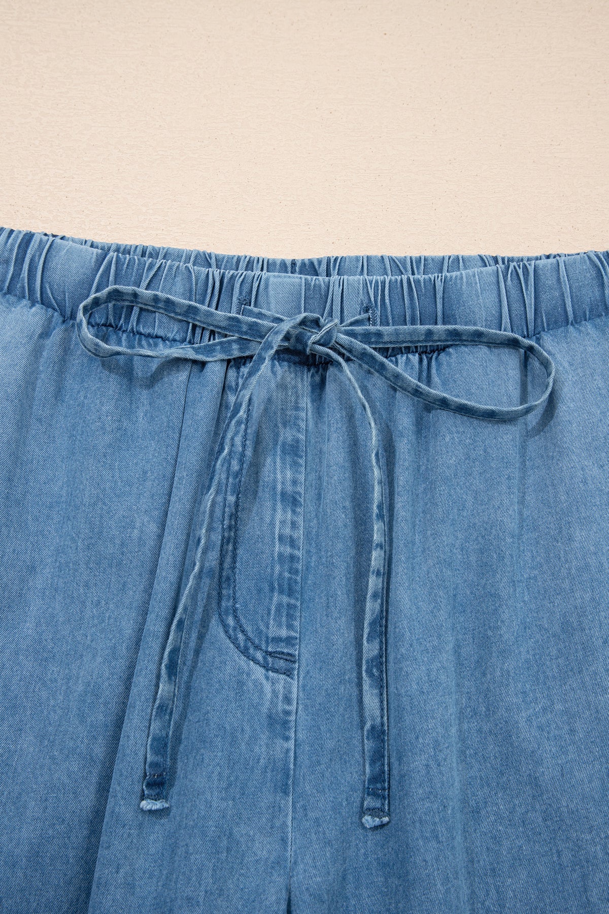 Dusk blue ruffled hem wide-leg chambray pants by Dear-Lover Dropshipping, made of 100% cotton, featuring a stylish relaxed fit.