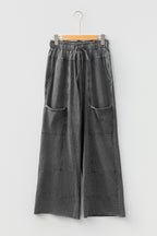 Medium grey high waist lace-up pants with raw hem, patched pockets, and lapis mineral wash, from Dear-Lover.