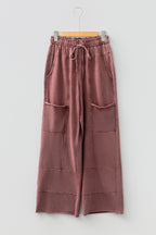 Medium grey high-waist lace-up pants with raw hem, patched pockets, and lapis mineral wash from Dear-Lover, casual bottoms.