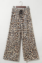 Flowy wide-leg pants with leopard print, drawstring elastic waistband, made of polyester, from Dear-Lover, casual culotte bottoms.