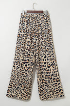 Flowy wide-leg pants by Dear-Lover in parchment leopard print with drawstring elastic waistband, made of lightweight polyester.