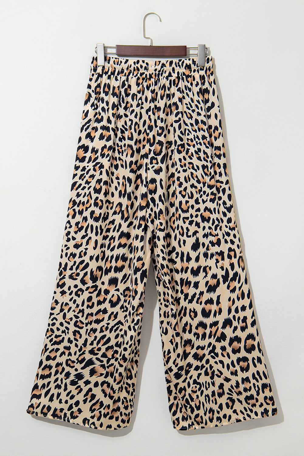 Flowy wide-leg pants by Dear-Lover in parchment leopard print with drawstring elastic waistband, made of lightweight polyester.