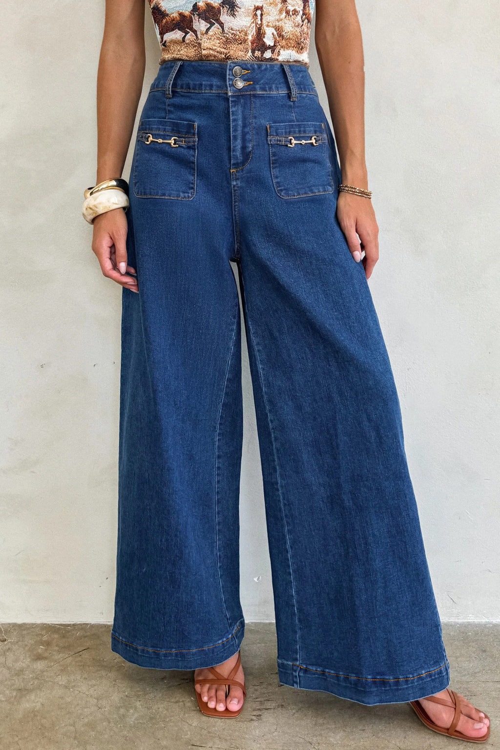 Sail Blue denim wide-leg pants with patched pockets and hardware decor, made from cotton, polyester, and elastane, by Dear-Lover.