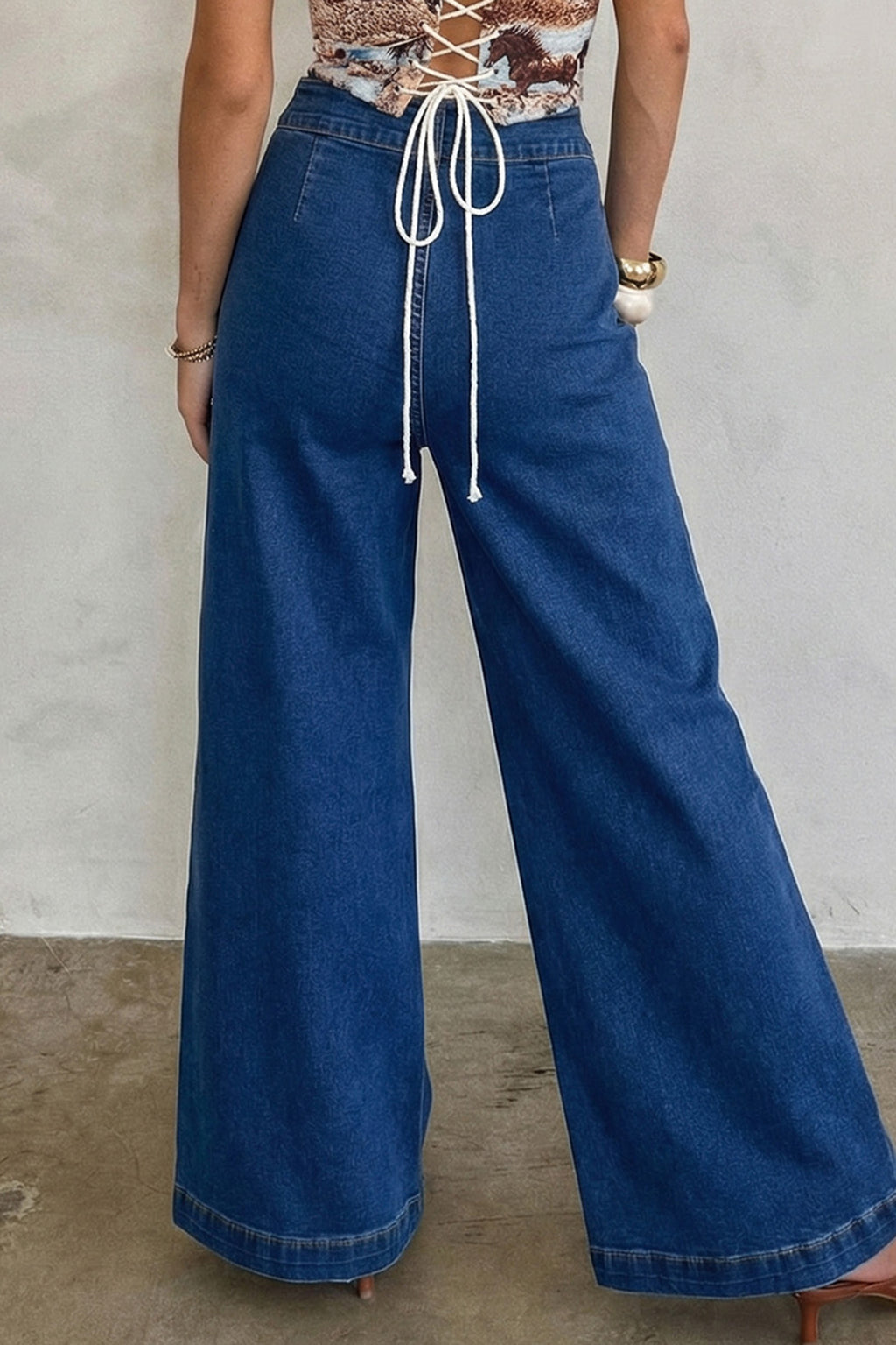 Sail blue denim wide-leg pants with patched pockets and hardware decor by Dear-Lover, made of cotton, polyester, and elastane.