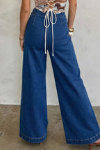 Sail blue denim wide-leg pants with patched pockets and hardware decor by Dear-Lover, made of cotton, polyester, and elastane.