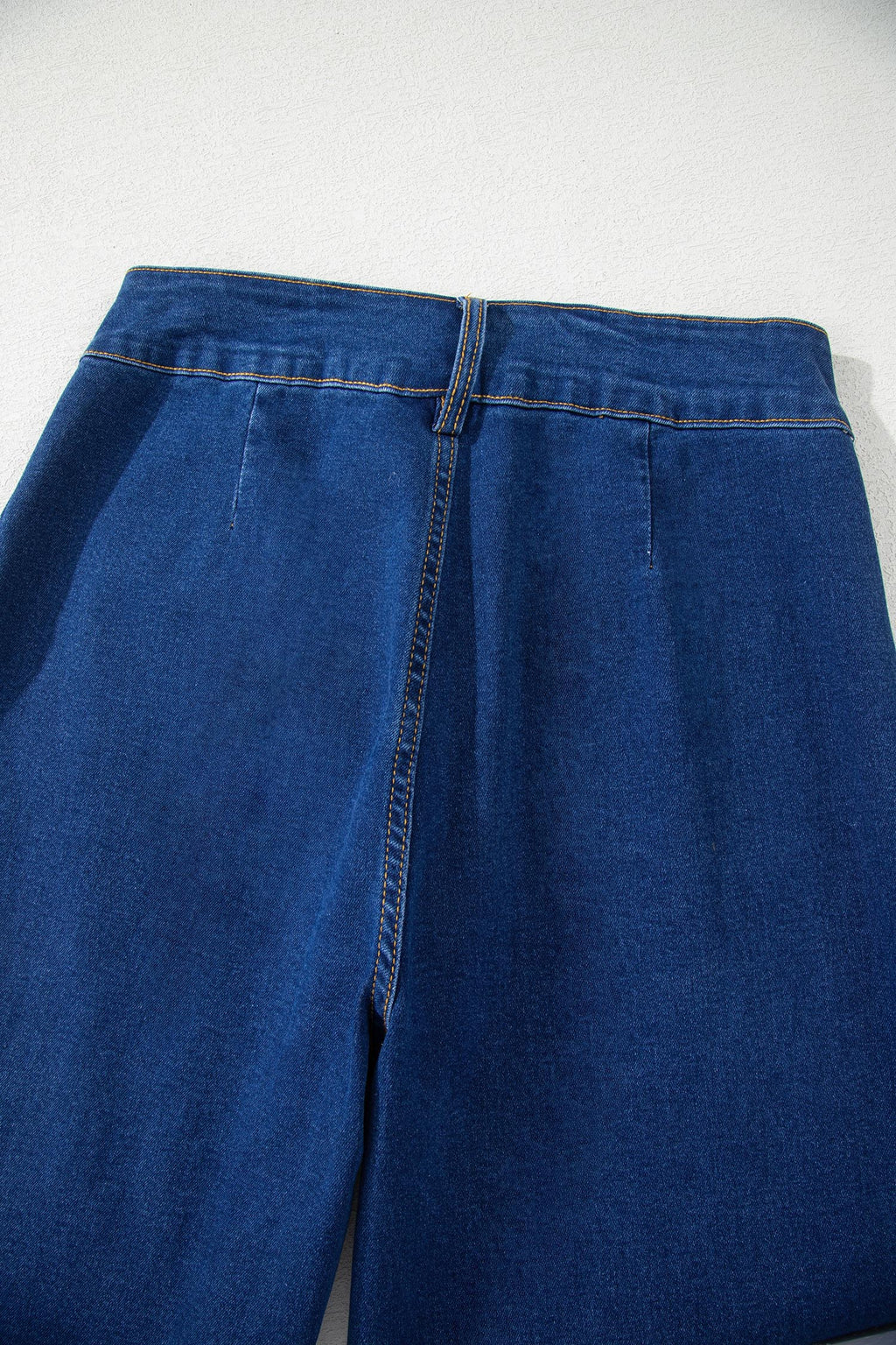Sail Blue denim wide-leg pants with patched pockets and hardware decor, made of cotton, polyester, and elastane, by Dear-Lover.