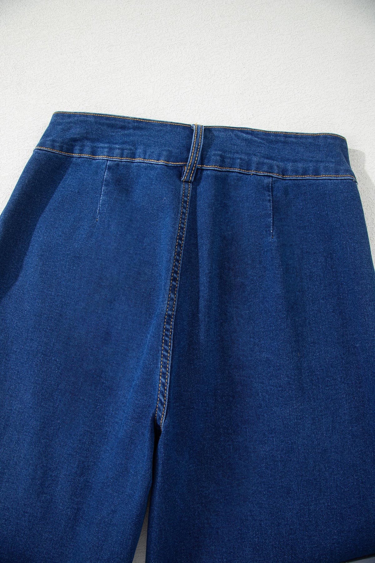 Sail Blue denim wide-leg pants with patched pockets and hardware decor, made of cotton, polyester, and elastane, by Dear-Lover.
