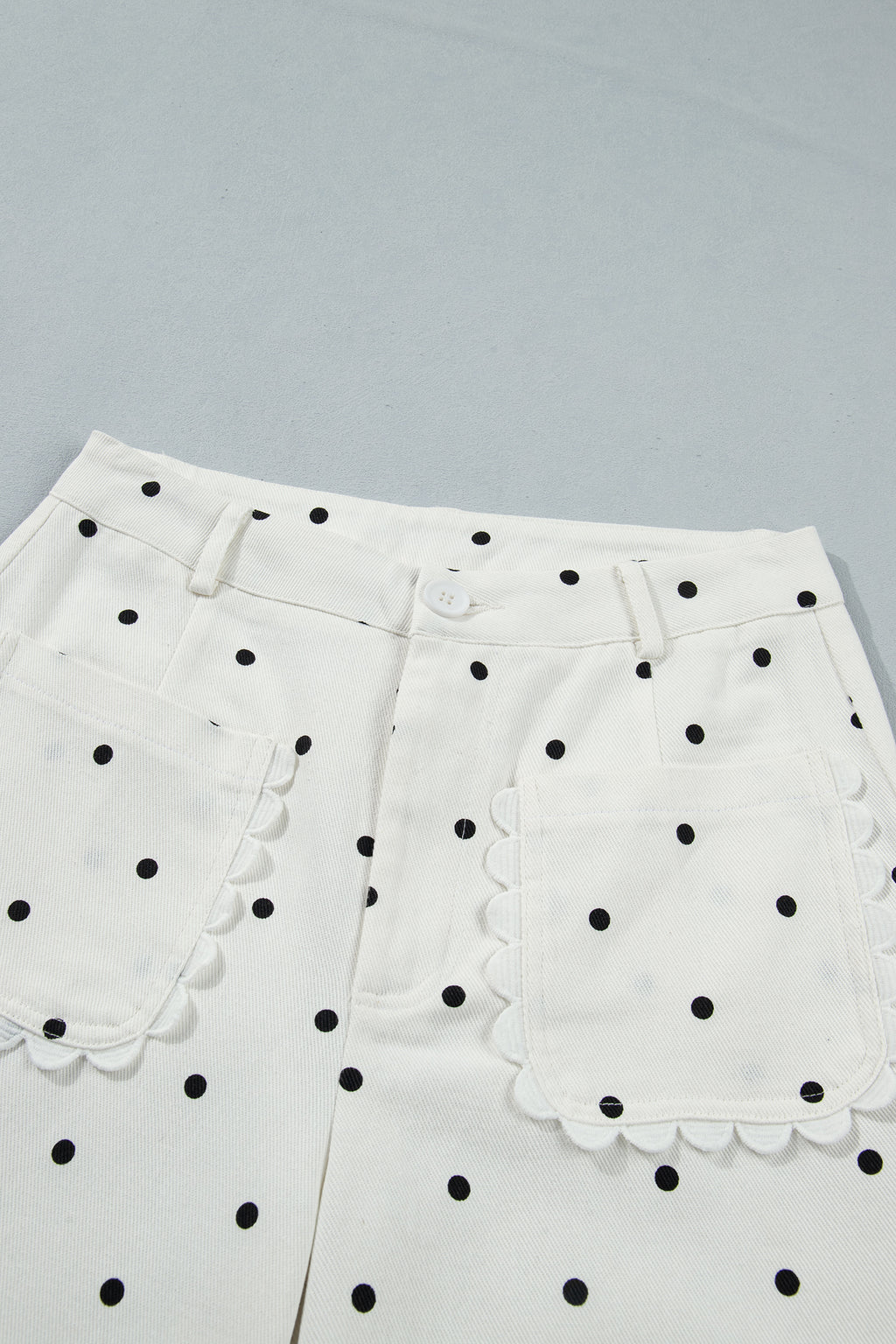 White polka dot cotton shift pants with scalloped patch pockets, casual bottoms by Dear-Lover with a relaxed fit.