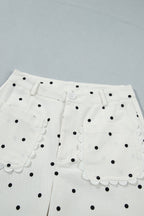 White polka dot cotton shift pants with scalloped patch pockets, casual bottoms by Dear-Lover with a relaxed fit.