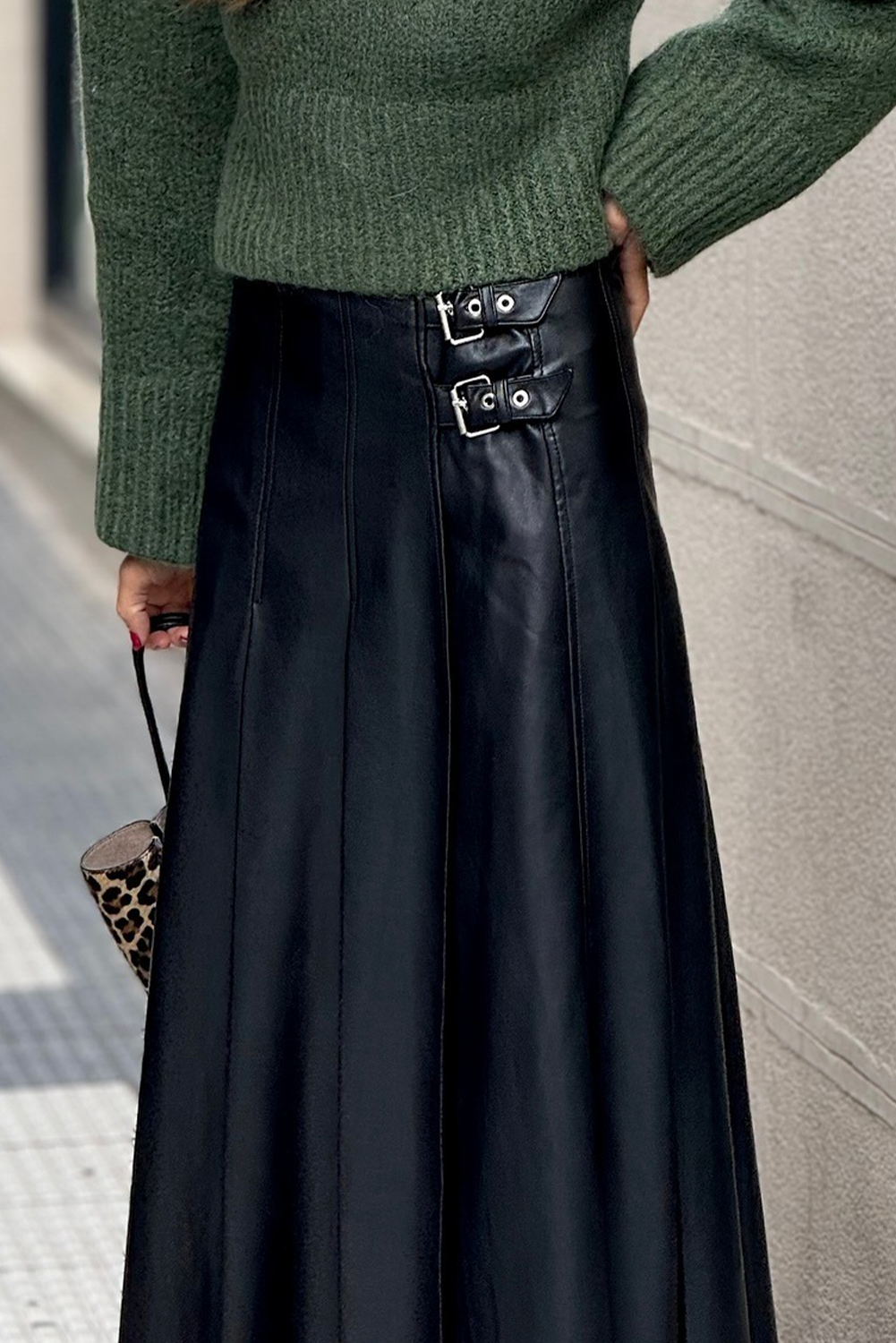 Black faux leather midi skirt with retro buckle detail, pleated stitch design, flared style, from Dear-Lover Dropshipping.