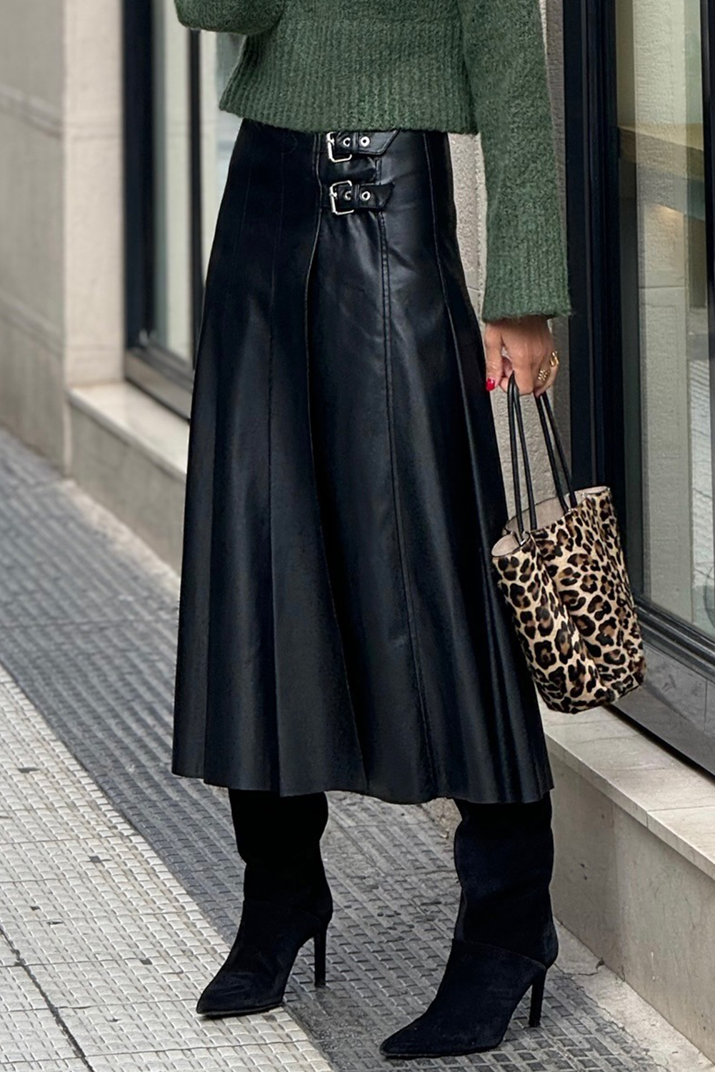 Black faux leather retro buckle detail pleated flared midi skirt by Dear-Lover Dropshipping, shown from side with pleats and buckle accents.