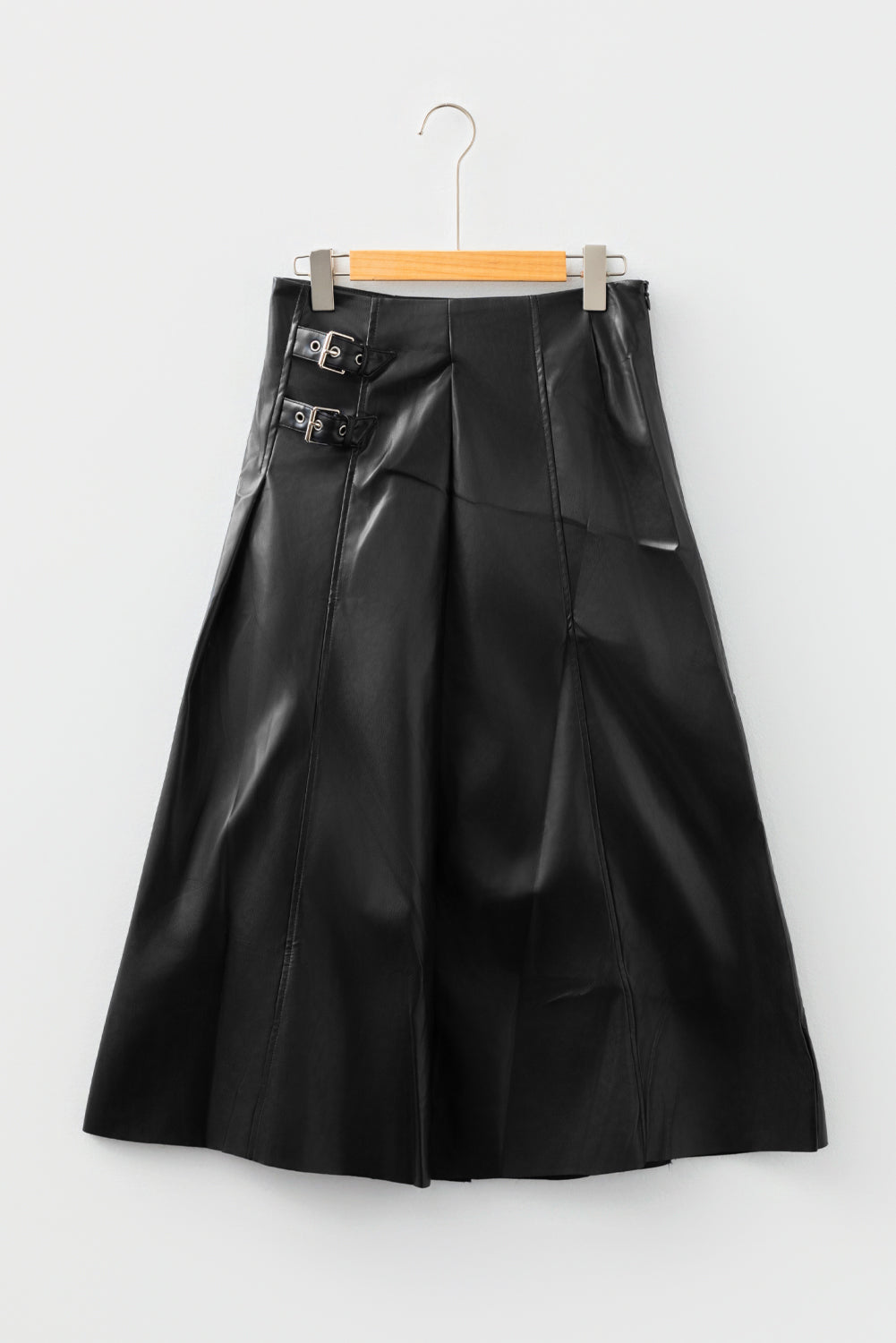 Black faux leather retro buckle detail pleated flared midi skirt by Dear-Lover Dropshipping, featuring stitch accents and a vintage-inspired design.