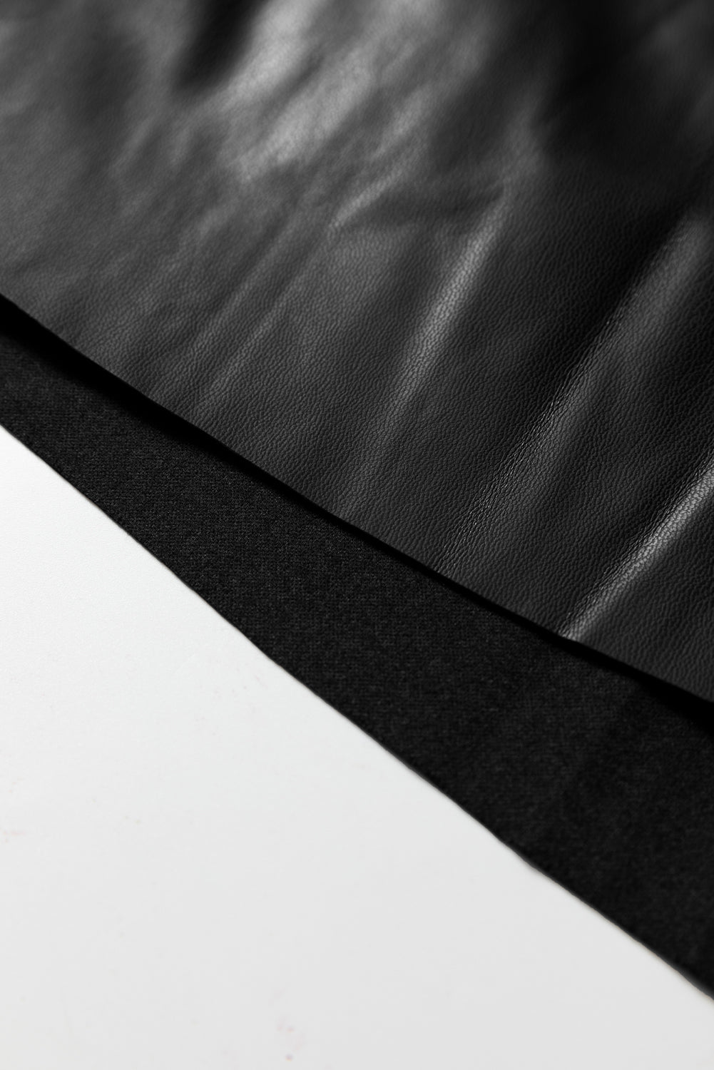 Black faux leather retro buckle detail pleated flared midi skirt from Dear-Lover, showcasing its stylish design and stitched accents.