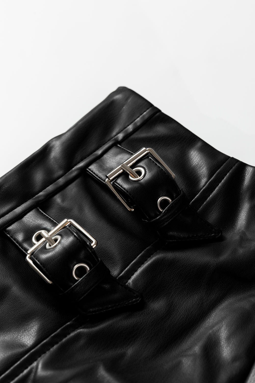 Black faux leather flared midi skirt with retro buckle detail, pleated stitch design, from Dear-Lover Dropshipping.