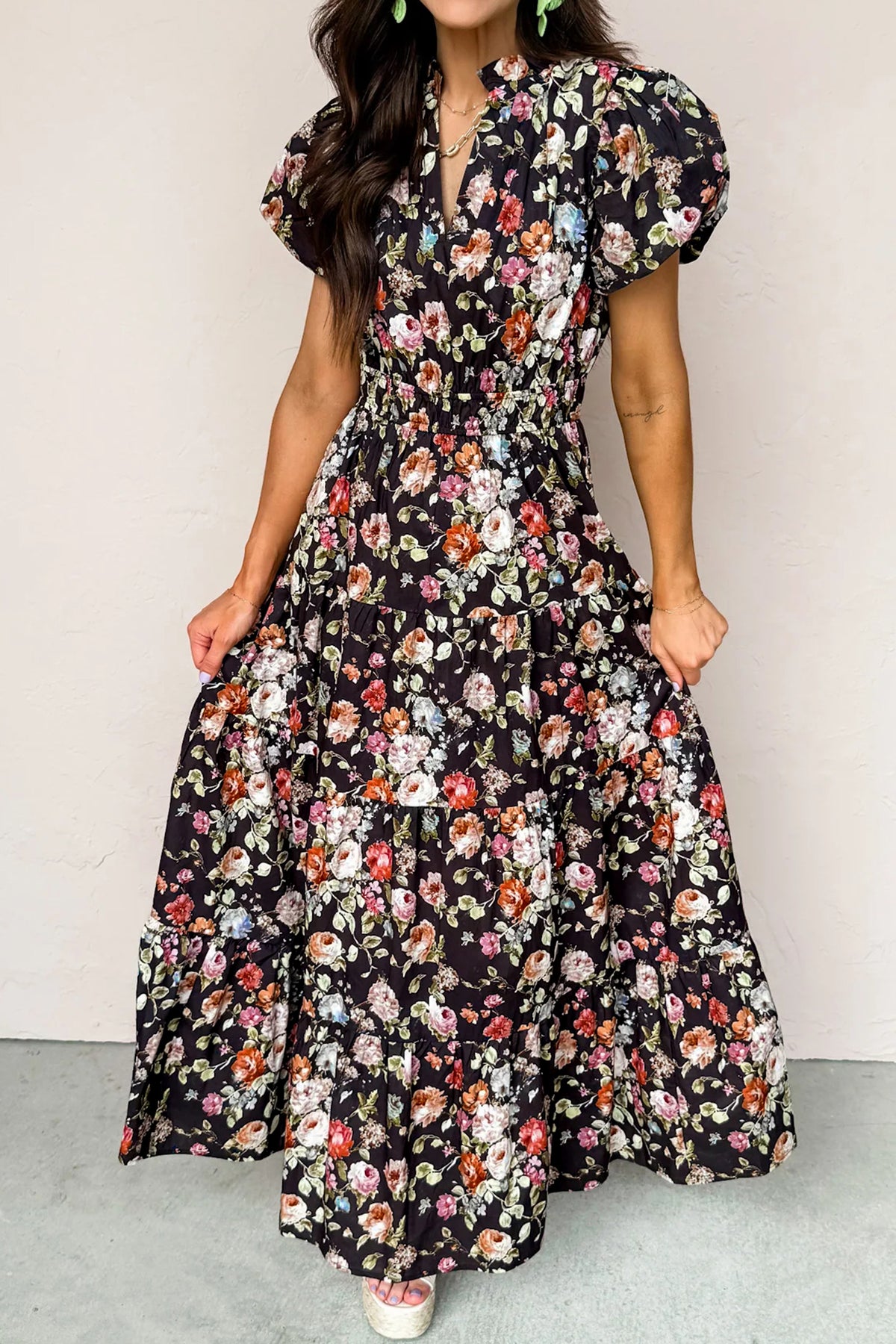 Black floral print V-neck pleated tiered maxi dress by Dear-Lover, showcasing a flowing, elegant floral design and lightweight fabric.
