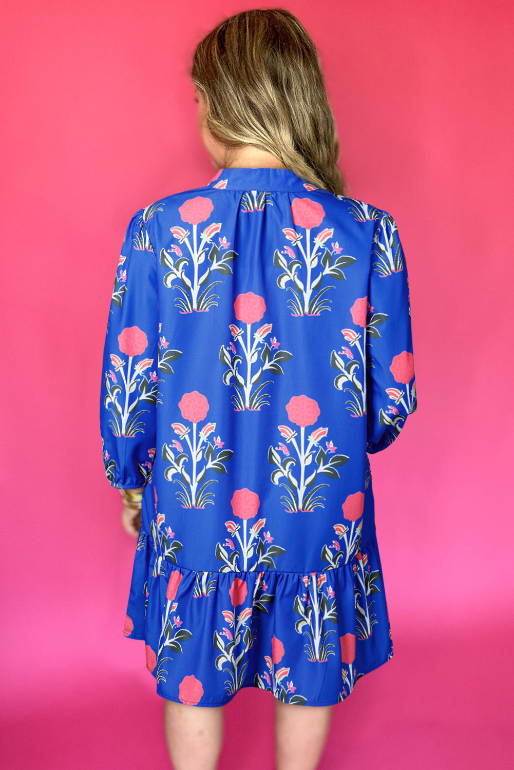 Blue floral print dress by Dear-Lover with button details, 3/4 puff sleeves, and ruffle hem, perfect for casual or dressy occasions.