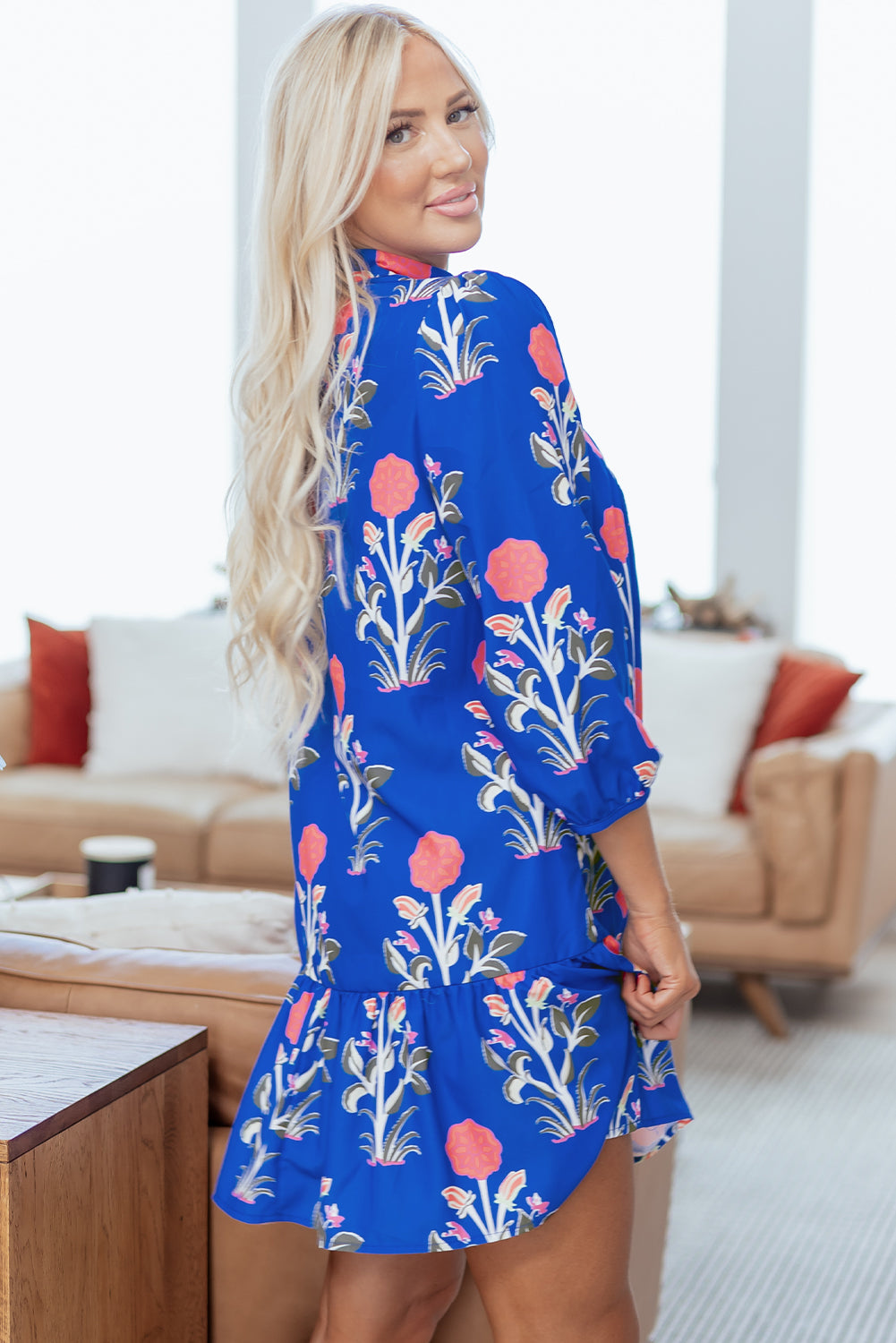 Blue floral print dress by Dear-Lover with button details, 3/4 puff sleeves, and ruffle hem, perfect for casual or semi-formal wear.