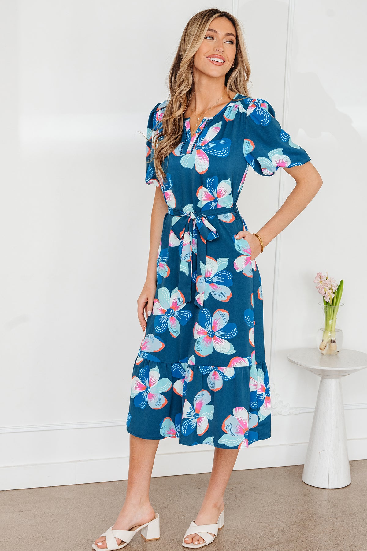 Blue floral print long dress by Dear-Lover with puff sleeves, ruffle hem, and belt, featuring a lightweight polyester fabric.