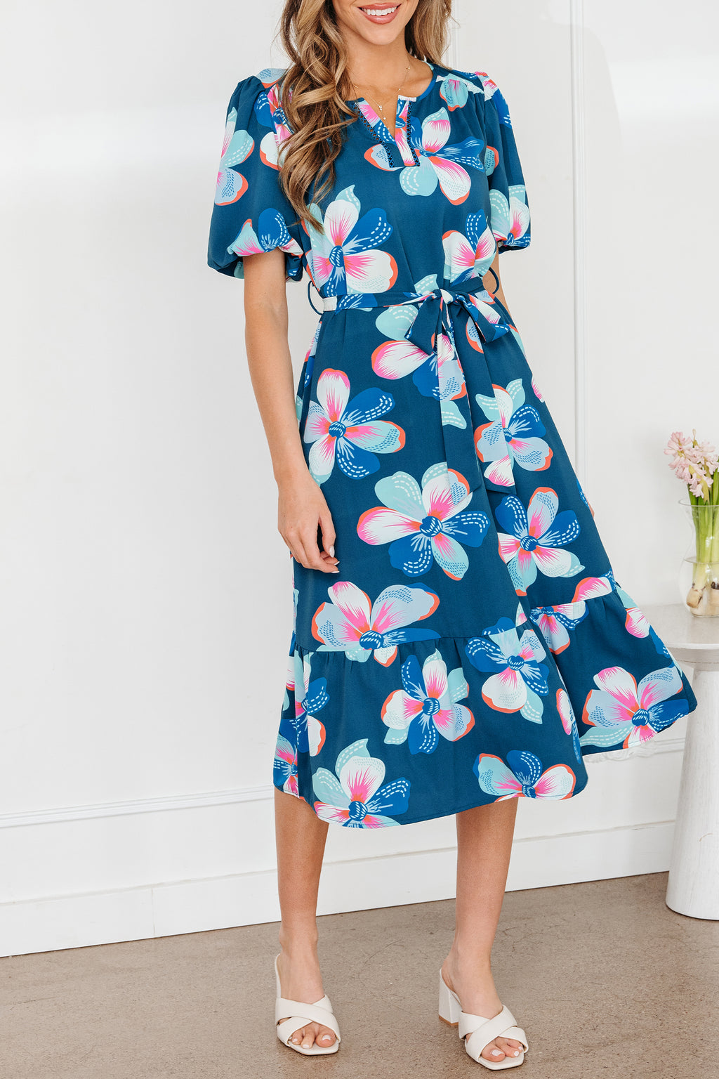 Blue floral print long dress by Dear-Lover with short puff sleeves, ruffle hem, and belt, made from lightweight polyester fabric.