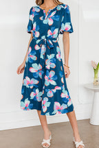 Blue floral print long dress by Dear-Lover with short puff sleeves, ruffle hem, and belt, made of lightweight polyester fabric.
