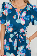 Blue floral print long dress with short puff sleeves, ruffle hem, and belt from Dear-Lover floral dress collection.