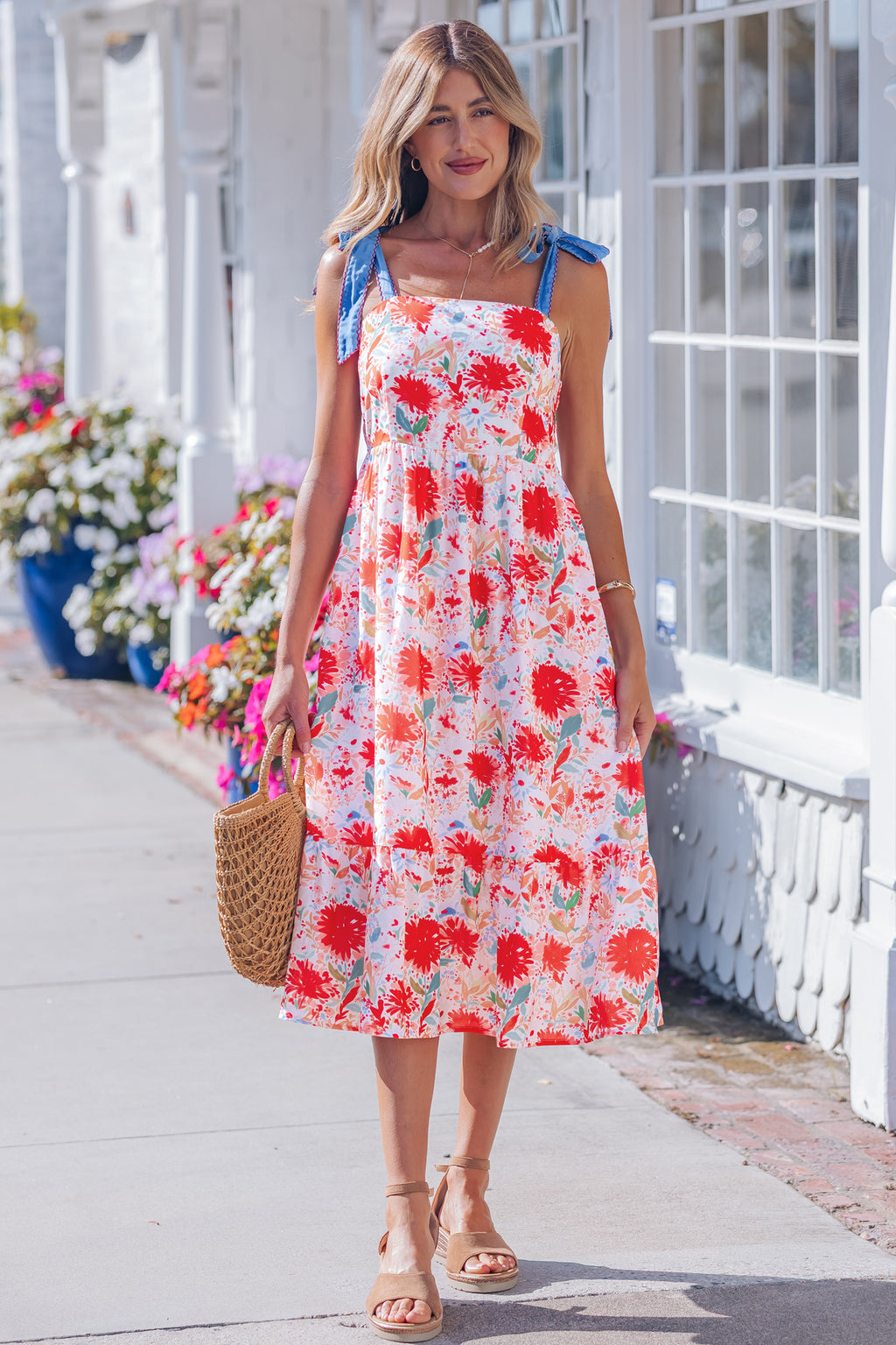 Red floral print high waist dress with contrast stitched knot denim straps, perfect for casual or summer wear.