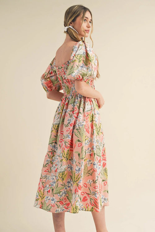 Apricot pink floral maxi dress by Dear-Lover with smocked bust, short bubble sleeves, and flowy design in polyester fabric.